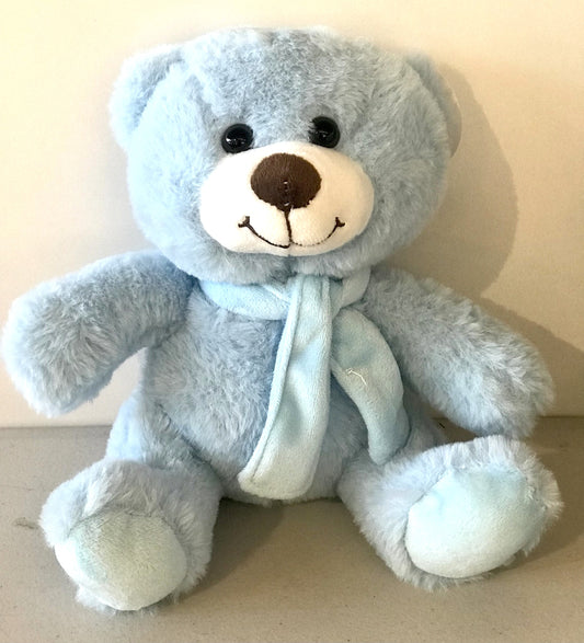 Soft blue plush teddy bear featuring a cosy matching scarf, approx. 24cm tall.