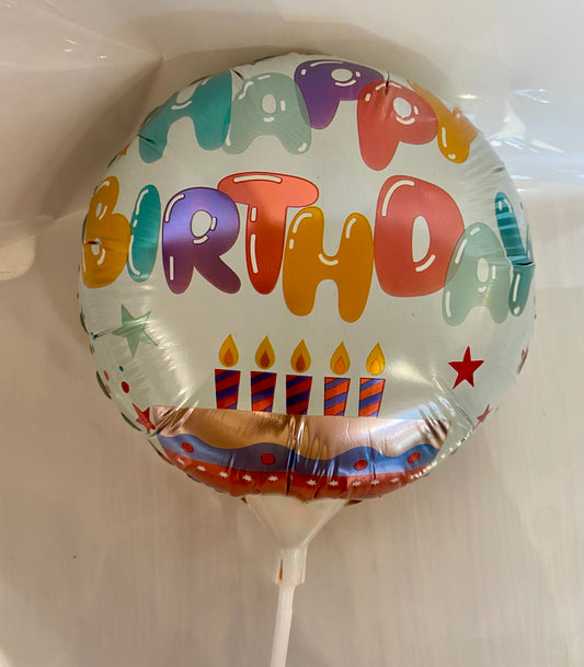 Round Happy Birthday foil balloon with colourful cake illustration, approx. 22cm in diameter.