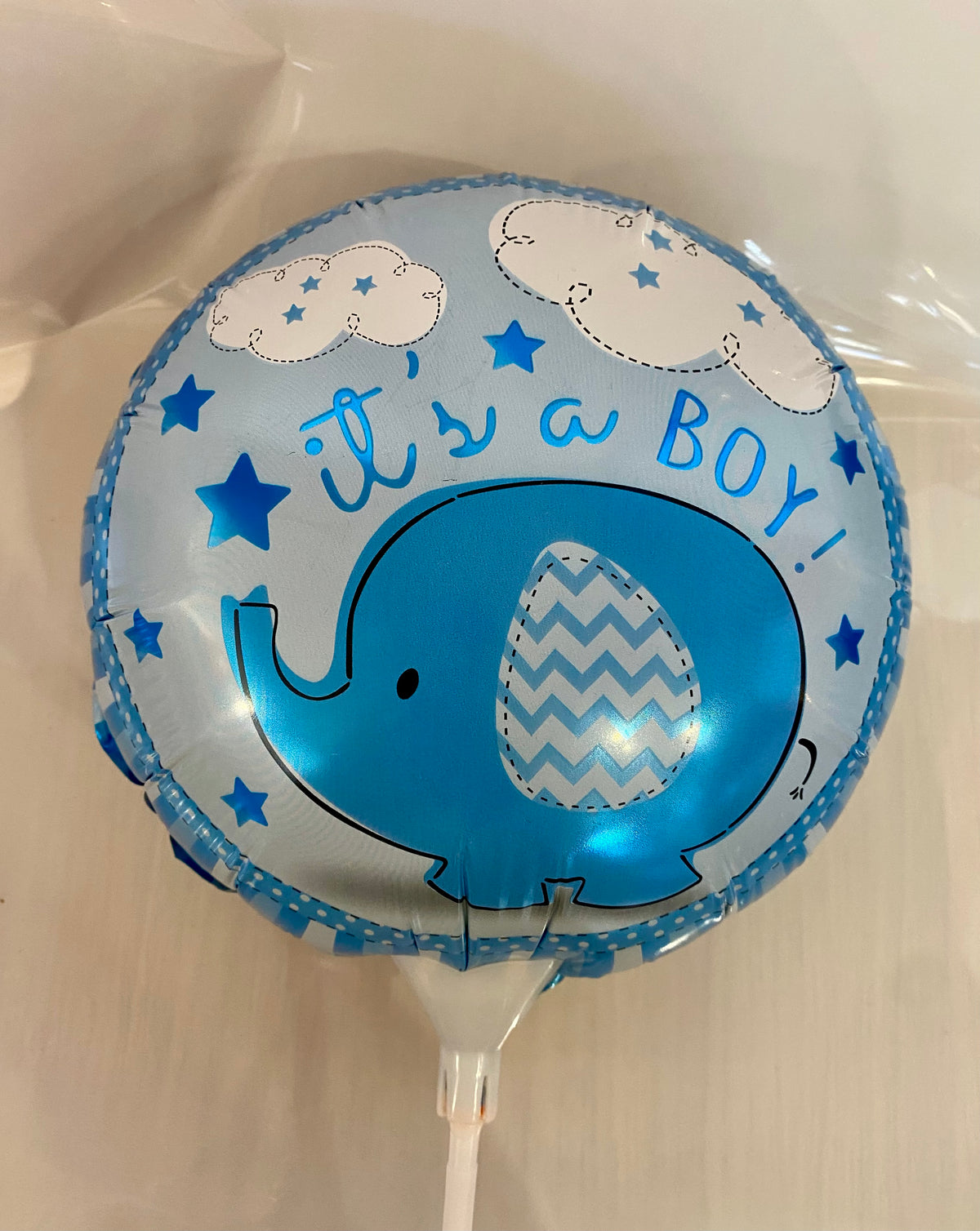 Round ‘It’s a Boy’ foil balloon featuring a cute blue elephant design, approx. 22cm in diameter.