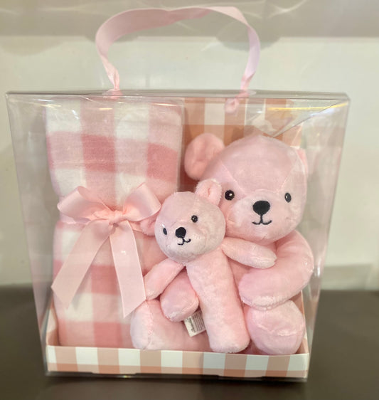 Pink baby gift pack featuring a soft pink teddy, cosy fleece blanket and matching baby rattle, presented as a sweet newborn gift set