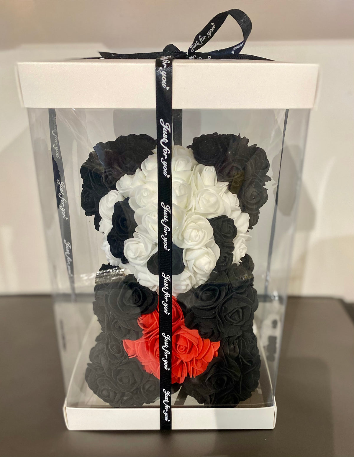Artificial rose panda bear, 25cm, displayed inside a clear gift box for a premium keepsake presentation