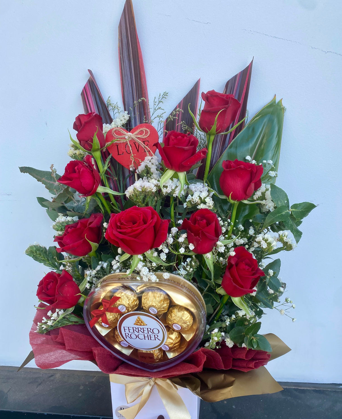 Rose & Ferrero Rocher Heart Chocolate Box featuring fresh red roses paired with Ferrero Rocher heart chocolates in a beautifully presented gift box.