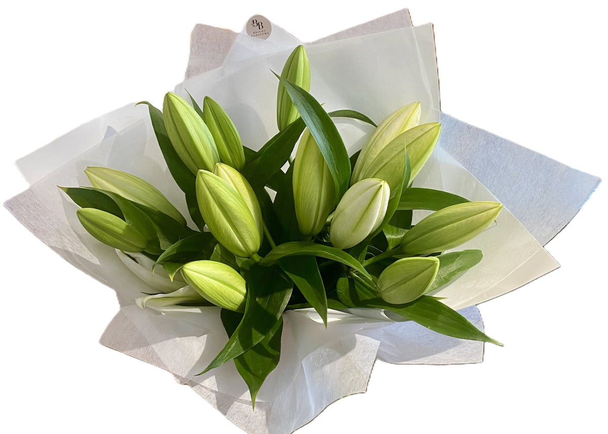White Lily Classic Bouquet featuring fresh white Oriental lilies arranged in a soft, elegant floral display.